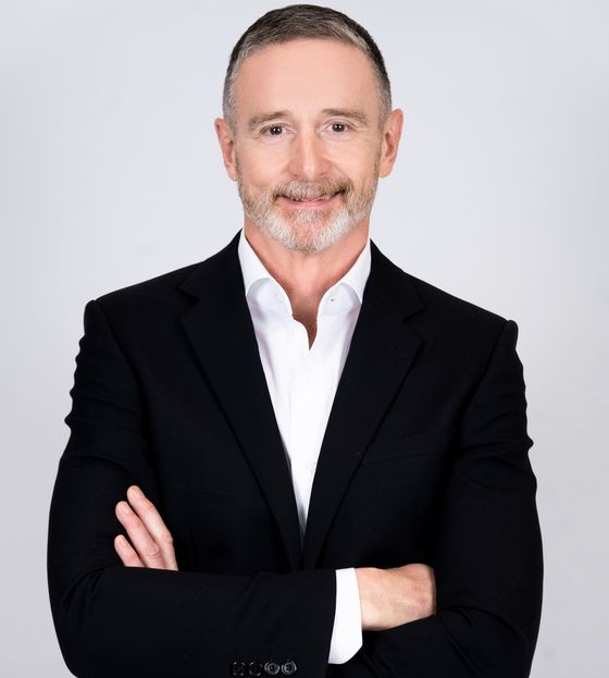 Portrait of Dennis Cusack, Licensed Real Estate Advisor.